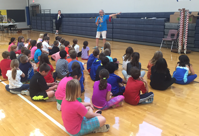 Physical education teacher Karen Ducharme teaches students about Jump Rope for Heart.