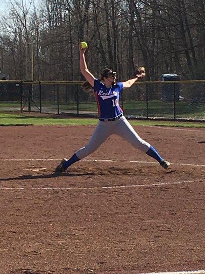 Weidinger demonstrates the form and skill of pitch as she practices for upcoming games.