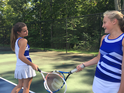 Tennis players practice and have fun on the courts.