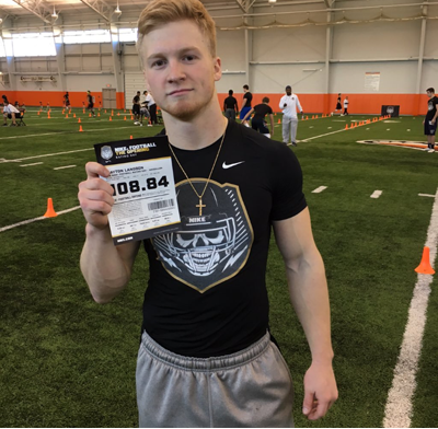 Langdon shows off his ticket signifying his performance at the combine.
