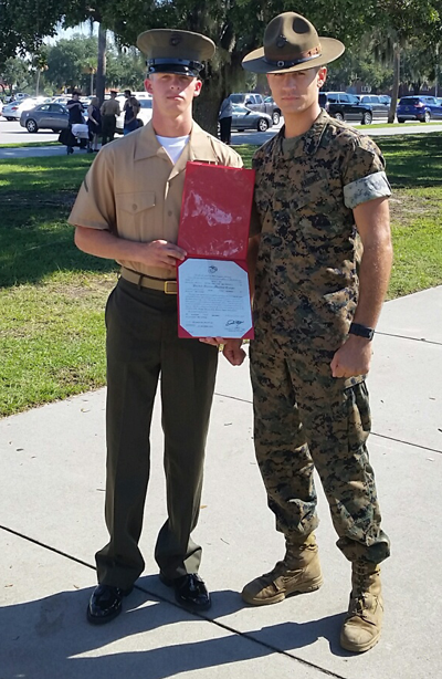Nye poses with his drill instructor Sergeant Long after graduation.