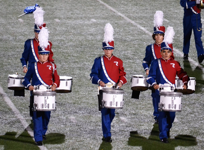 The band’s drumline dazzles the crowd during their performance. 