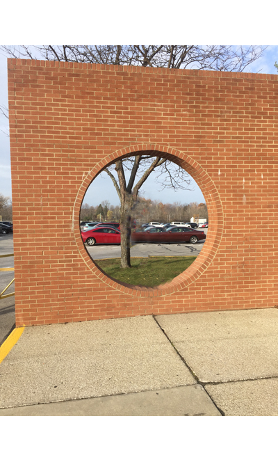 The iconic Hole in the Wall sits at one of the main entrances to the high school.