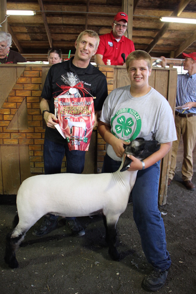 Luther (right) helps his family raise livestock for the Summit County Fair.