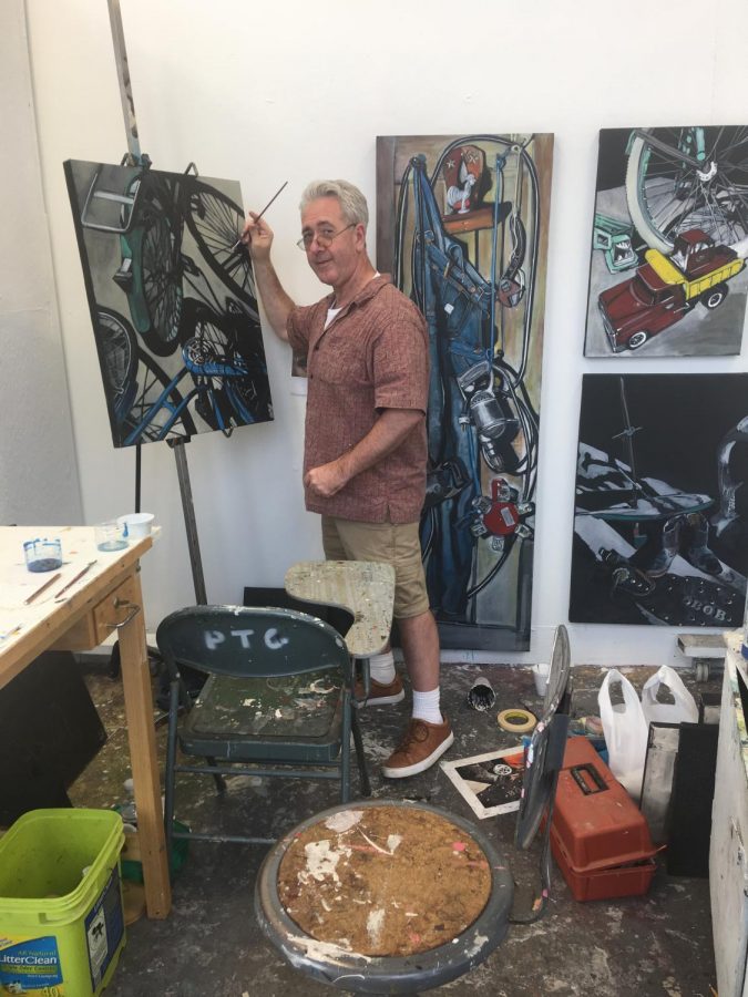 Pierson works on his projects at his art booth at the Cleveland Institute of Art.