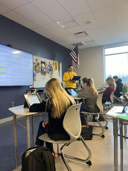 Jeff Dallas teaches students in his classroom for the Minuteman Career Academy.
