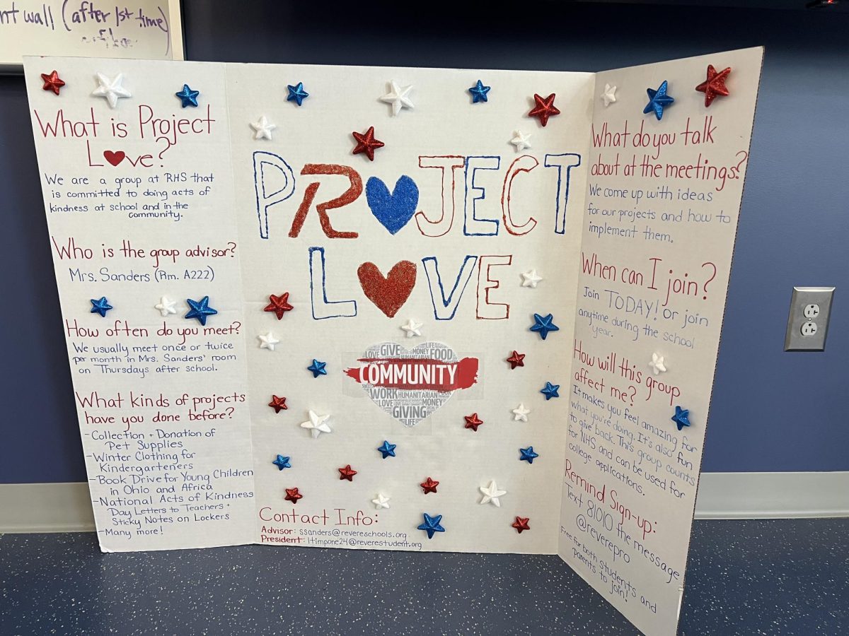 A Project Love poster in Susan Sanders classroom explains what the club is, where it meets and how to join. 