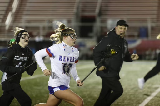 Sophomore Bentley Huffman runs toward the goal with her lacrosse stick. 