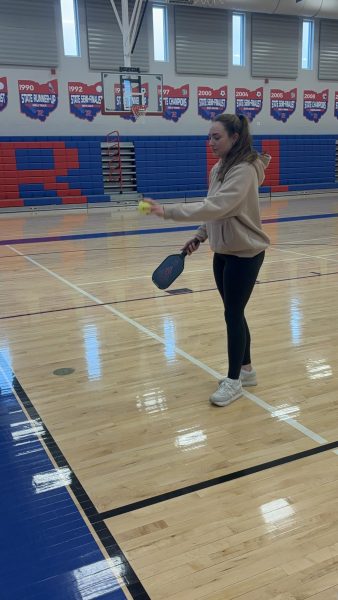 Junior Lauren Tompkins practices pickleball for her club that she founded. 