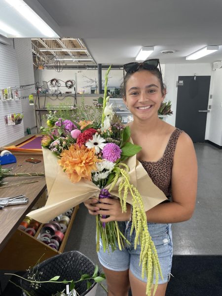 Angelina Camardo holds a bouquet at Countryside Florist while she is working. 
