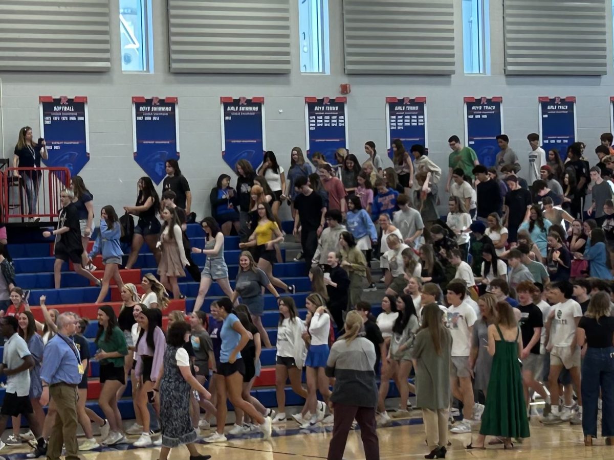 Students move to their respective spots in the gym after the ceremony. 