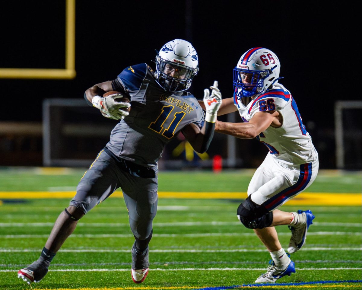 Brody Bard makes a tackle against the Copley Indians.