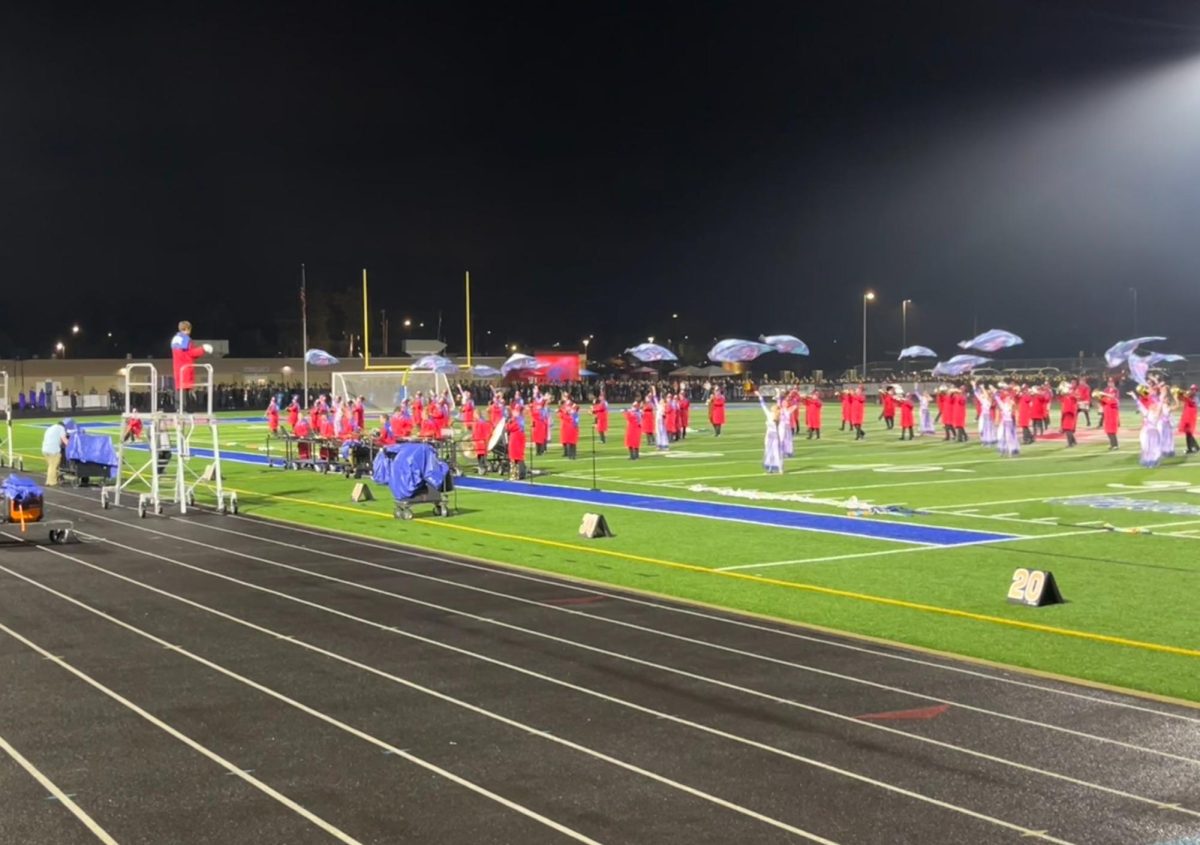 The Revere Marching Band performs at their home invitational in the RHS stadium. 