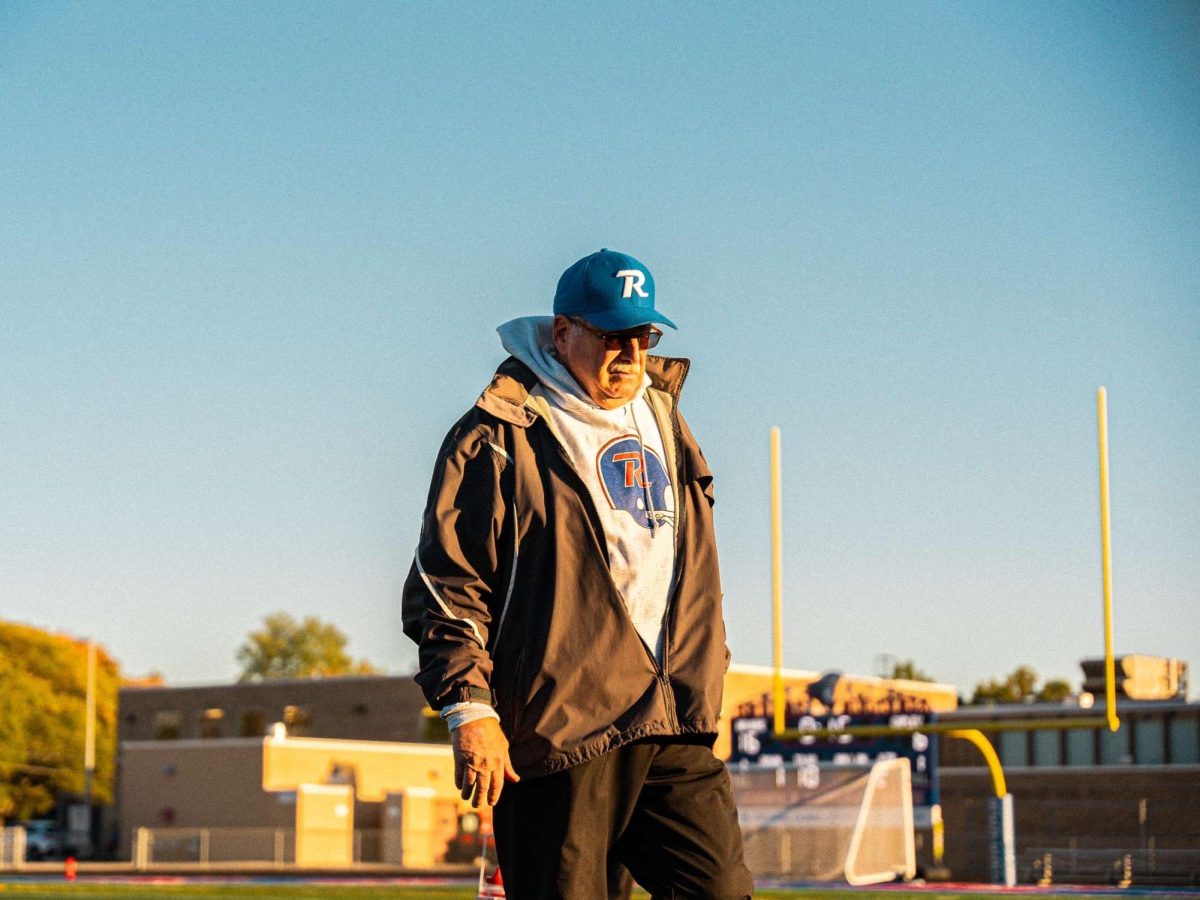 Coach David Flegal walks to sideline during a victory for the Revere freshman football team over their rival.