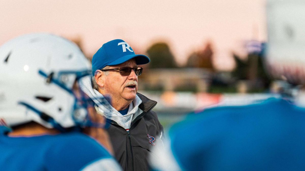 Coach David Flegal talks to the Revere defense during a timeout.