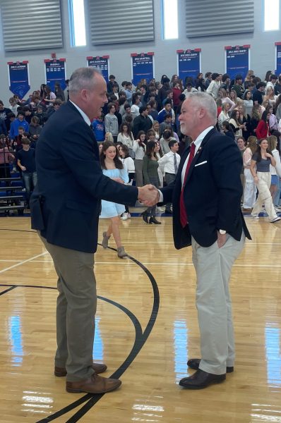 McClellan shakes hands with RHS Principal Doug Faris at the Veteran’s Day assembly.