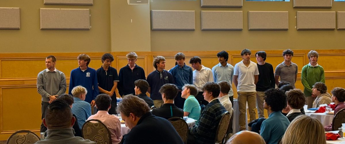 Members of the RHS men’s soccer team stand at their banquet. 