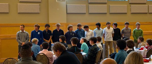 Members of the RHS men’s soccer team stand at their banquet. 