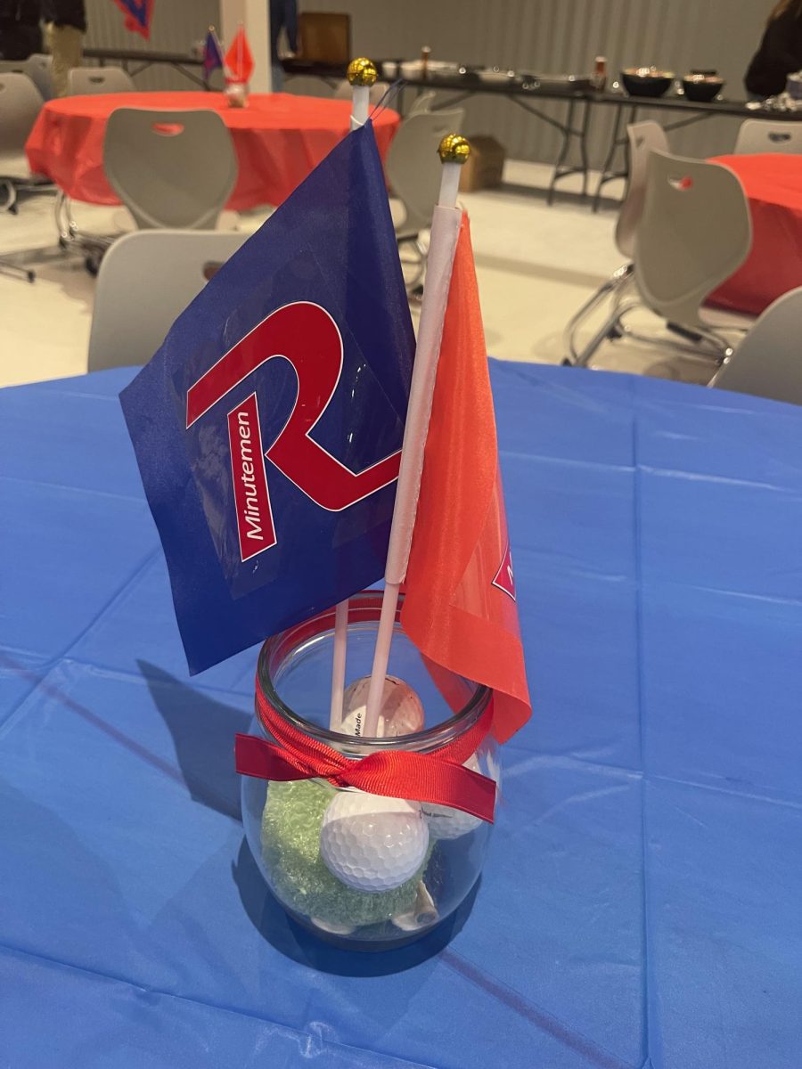 Tammy Kinder sets up golf banquet in the RHS cafeteria. 