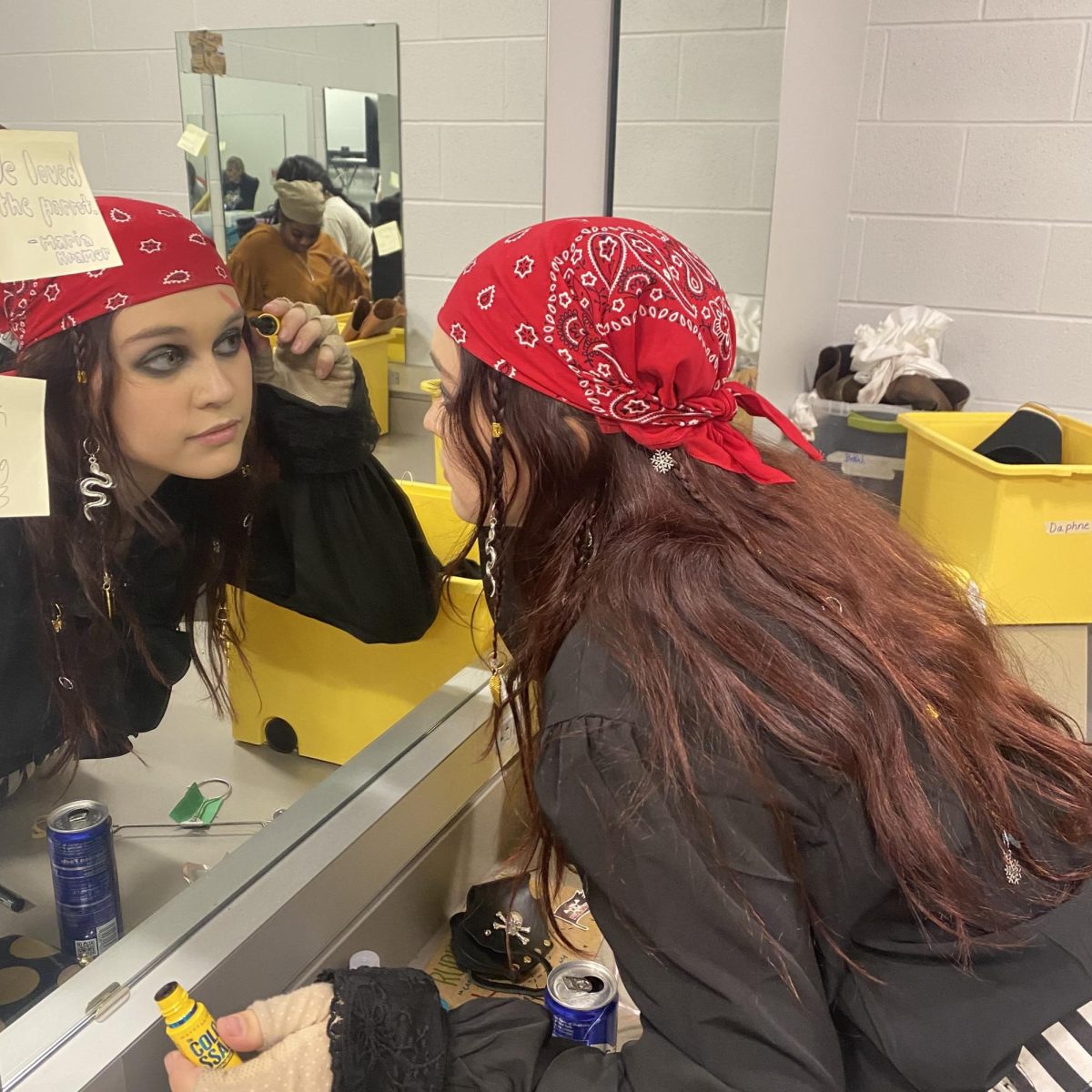 Aldrich applies make-up before a performance of Treasure Island. 