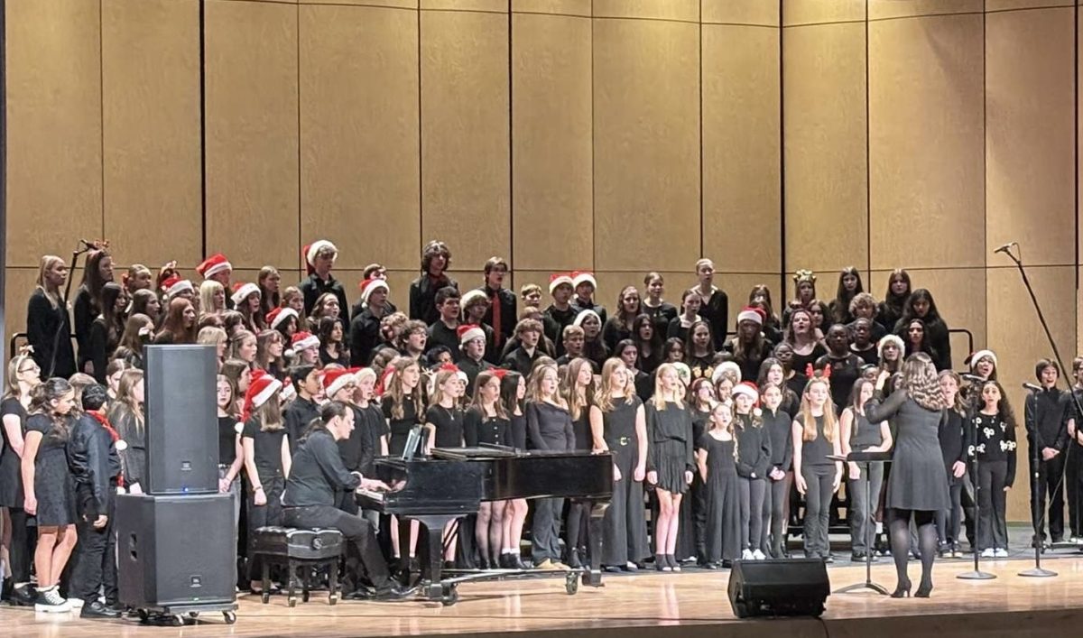 Choir students from all levels perform together during the winter choir concert.