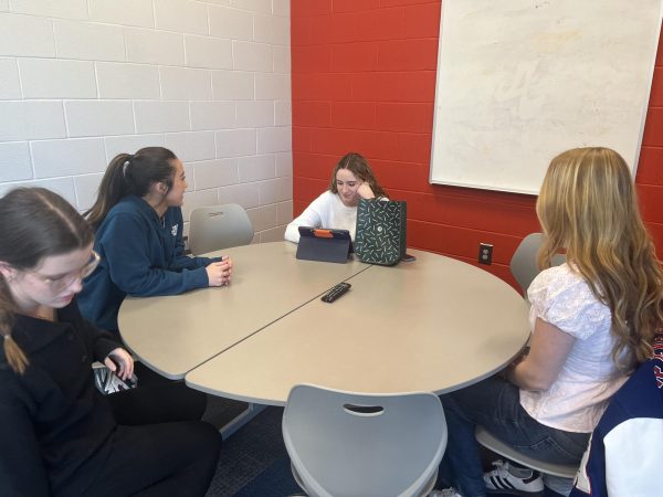 Empower Women’s board meets in a Revere High School common room. 