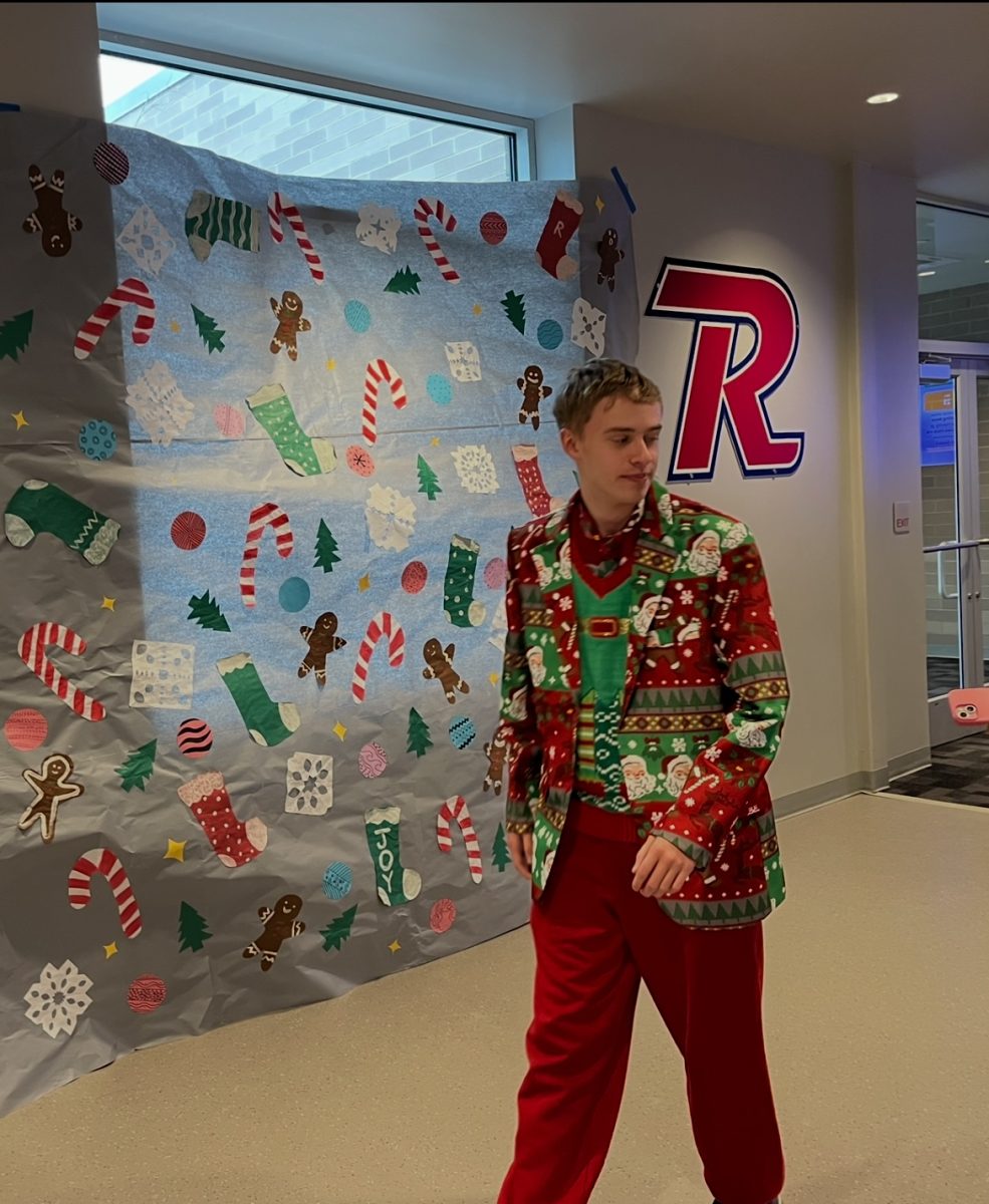 Leigh dressed  head to toe in holiday attire during the annual ugly sweater contest.