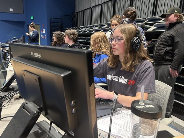 Steiner works at the RHS light board for the Variety Show.