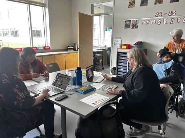 Intervention specialists sit in their classroom at RHS and help students. 