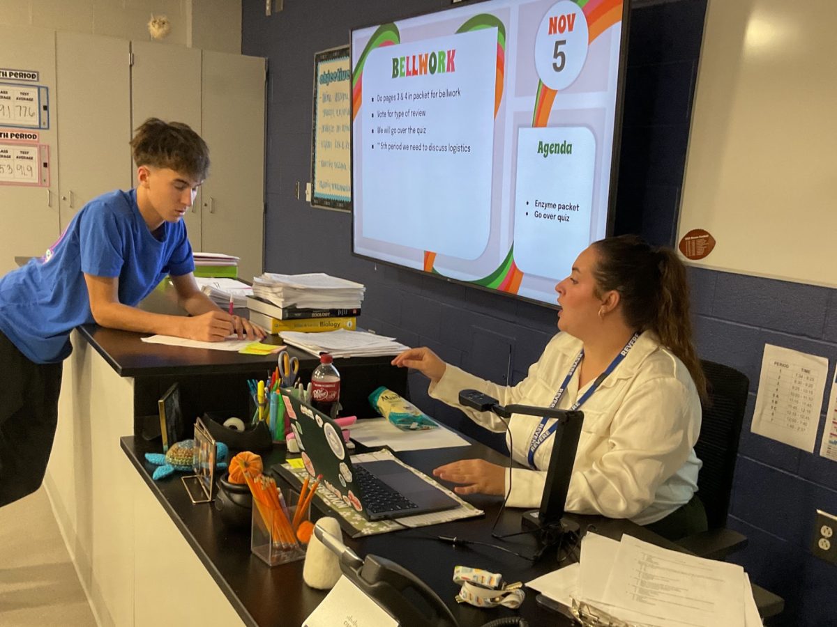 Jess Hiltbrand talks to a student during one of her biology classes.