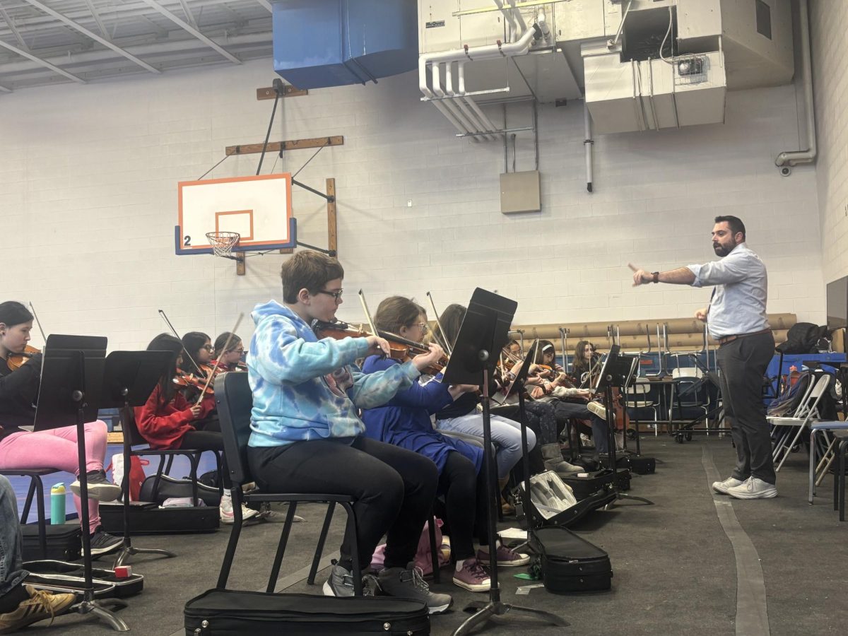 Bowman teaches his music students at the Revere Middle School.