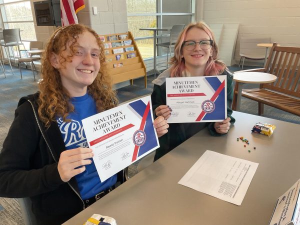 Reese Patton and Abby Hetman celebrate their recent Momentum Meal nominations.